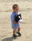 Dylan (Fevergeon grandchild) enjoys a romp on his stick horse.