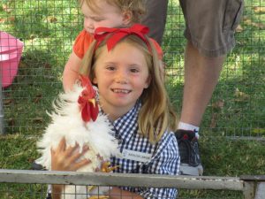 Kathleen Lanigan (7) enjoyed the chicken in the petting zoo.